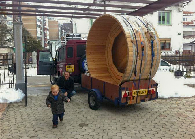 A big hot tub loaded onto a tiny trailer in transit to Montenegro